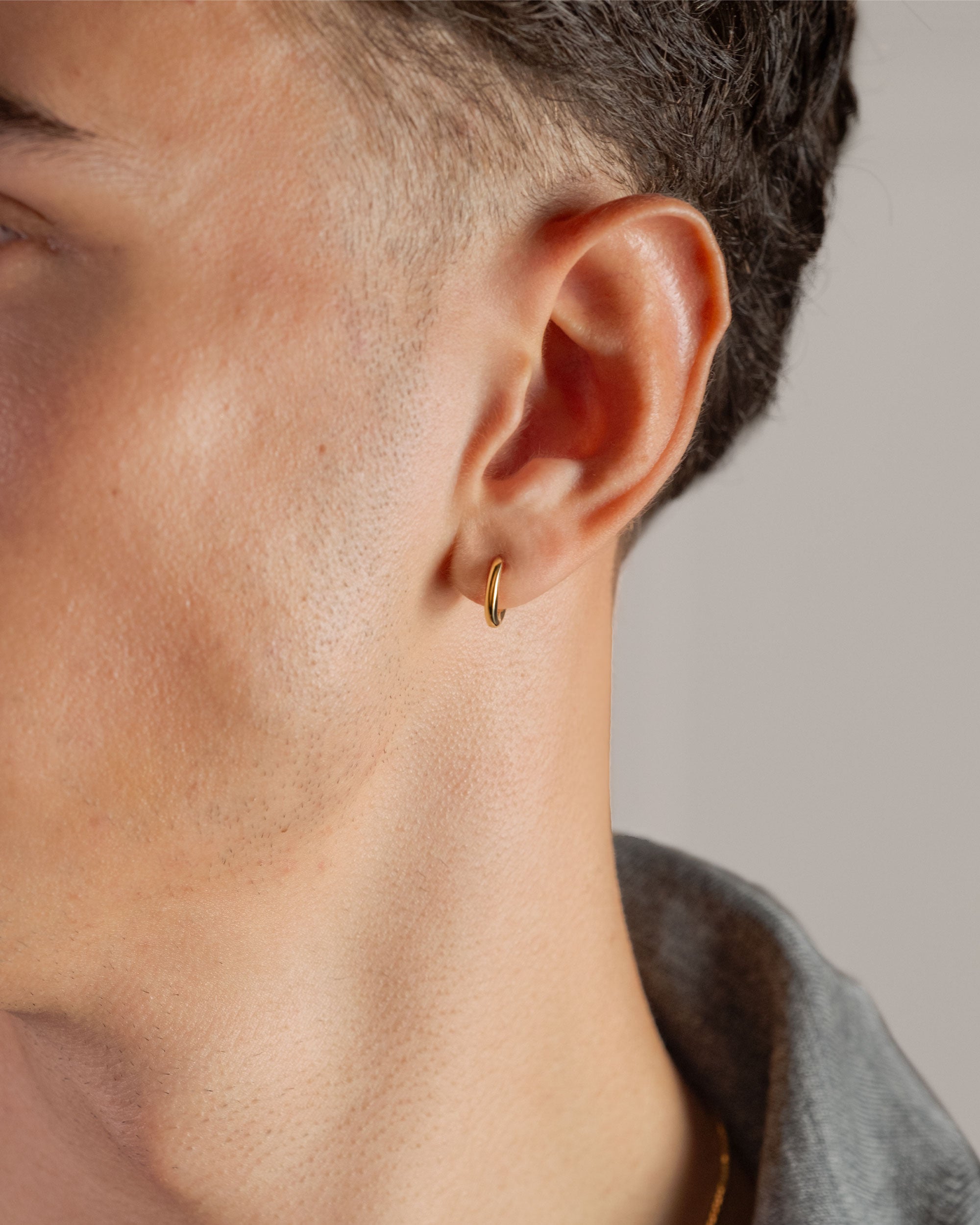 gold plated medium 12mm hoop earring worn on ear – close-up – Fravour
#material_14ct Gold Plated