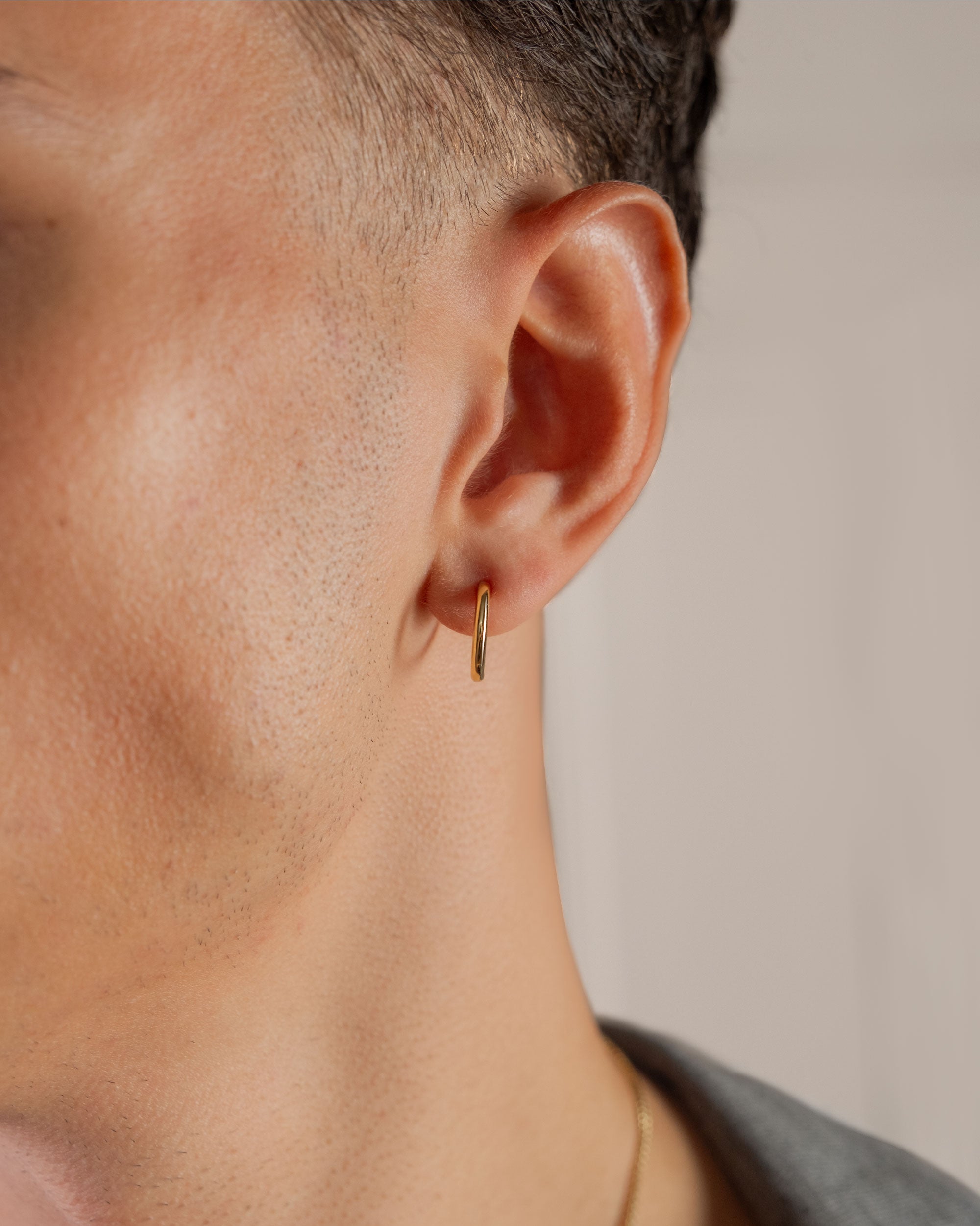 gold plated large 15mm hoop earrings worn on ear – close-up – Fravour
#material_14ct Gold Plated